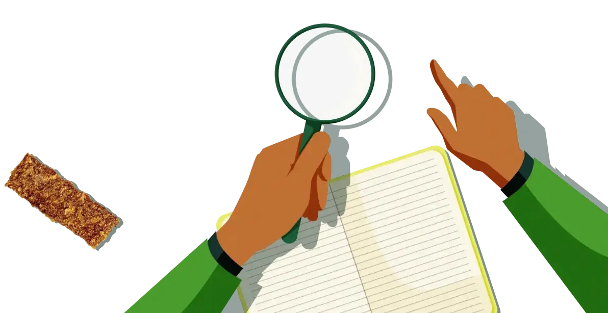 Hands searching a book with a magnifying glass